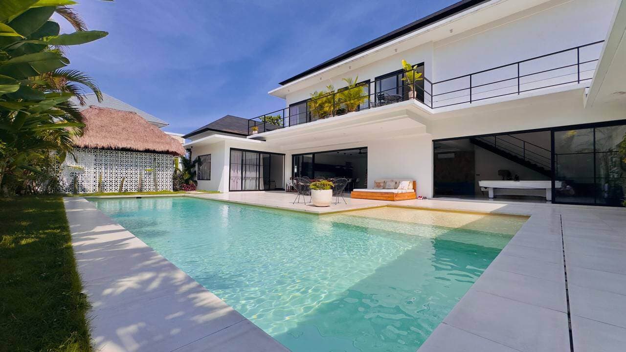 White two-storey villa with large pool and tropical garden in Bali — Frigate Bali